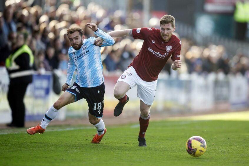 Paul McMullan takes on Arbroath player