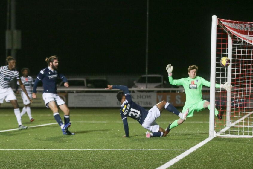 Derick Osei stretches to score a late equaliser for Dundee at Queen's Park in October. Image: David Young/Shutterstock