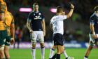 Glen Young is shown a yellow card from referee Luke Pearce.