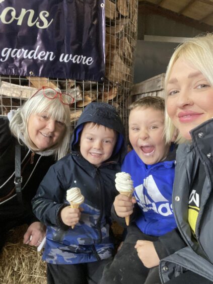 Lynne with her sons, both eating ice creams, and her mother in law Sandra Miller on a day out. 