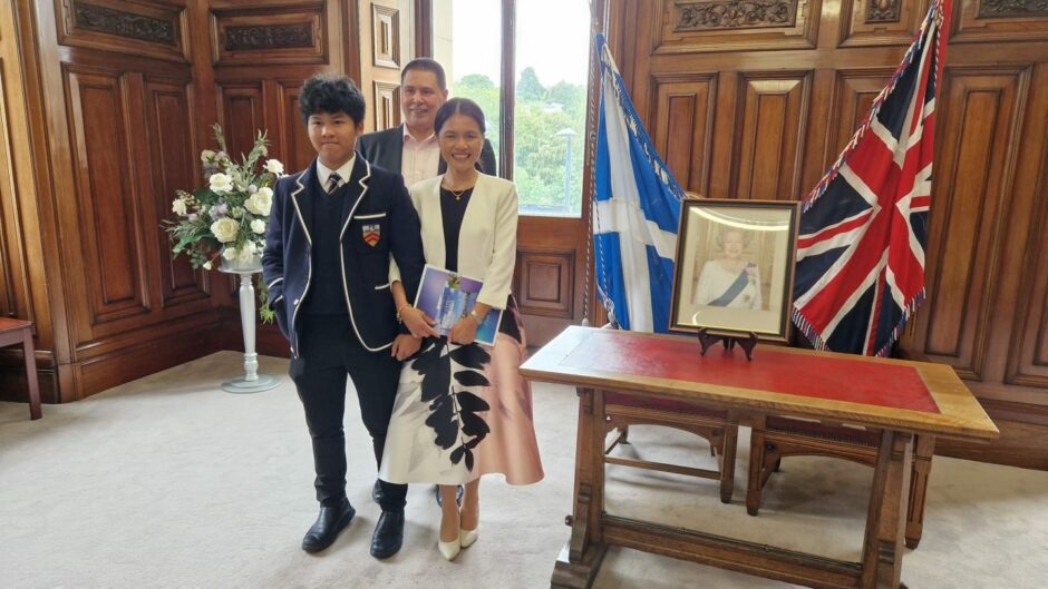 Jiw at her citizenship ceremony with Nick and Poom. Image: Nick Holt.