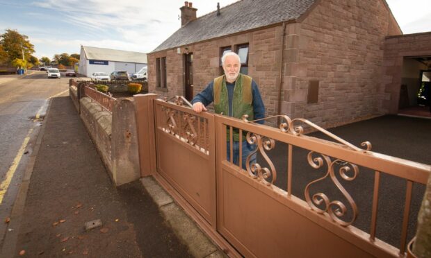 John Ewen with the floodgates at his Forfar home which stopped a September deluge.