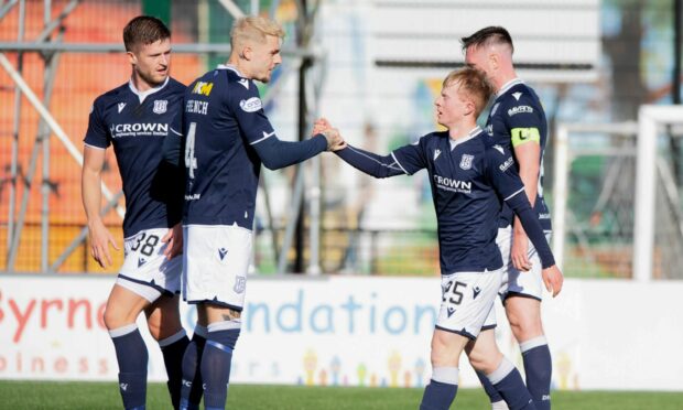Lyall Cameron is congratulated after scoring Dundee's opener.