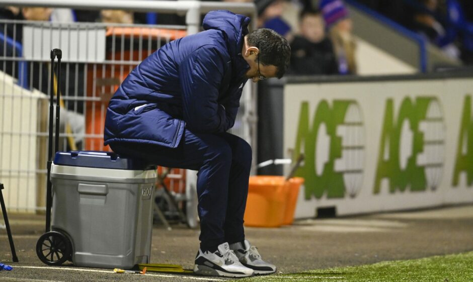 Dejected Gary Bowyer in Dundee dugout.