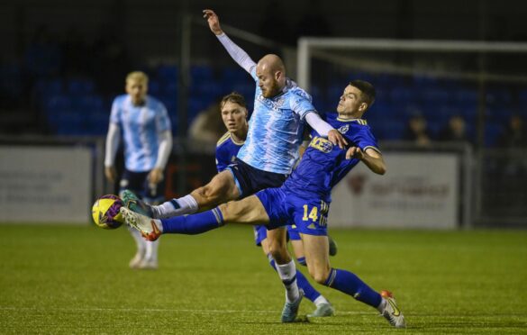 Cove Rangers' loan star Charlie Gilmour challenges Dundee's Zak Rudden. Image: SNS