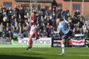 Zak Rudden makes it 1-0 to Dundee at Arbroath. (Image: SNS)
