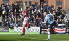 Zak Rudden makes it 1-0 to Dundee at Arbroath. (Image: SNS)