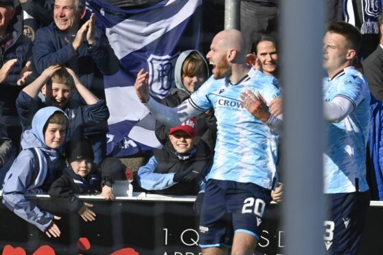 Rudden celebrates in front of the Dundee fans after opening the scoring at Arbroath (Image: SNS).