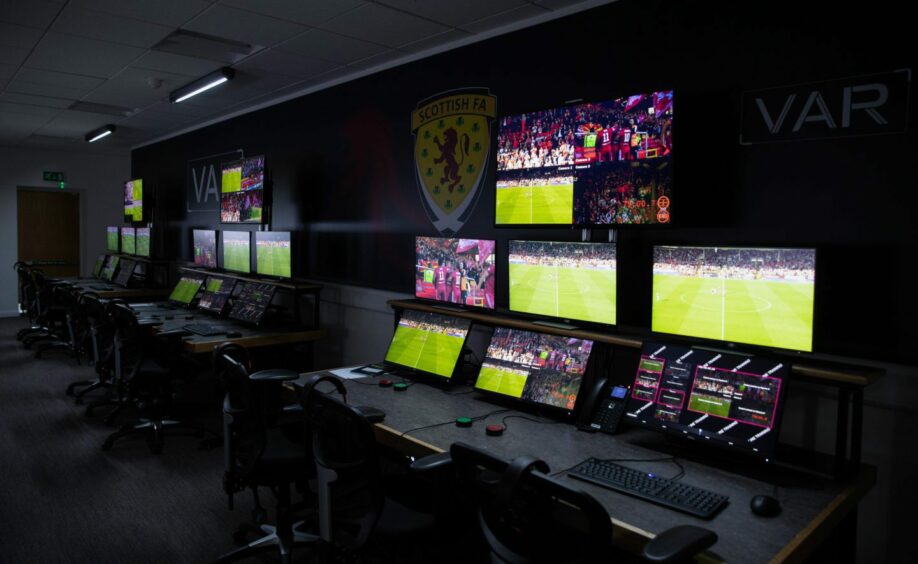 A bank of monitors in the VAR room.