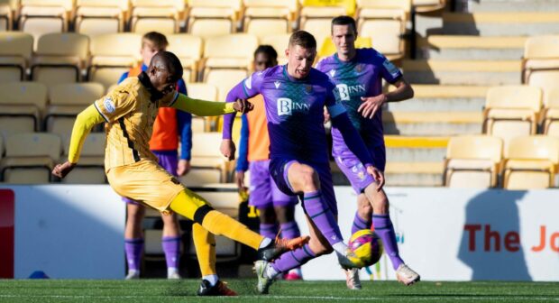 Dylan Bahmboula (L) scores to put Livingston ahead against St Johnstone. Image: SNS