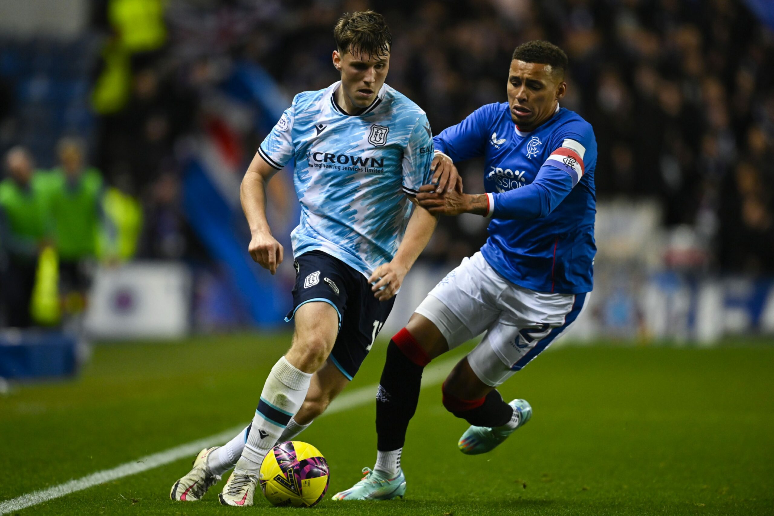 Dundee kid Josh Mulligan takes on Rangers skipper James Tavernier (Image: SNS).