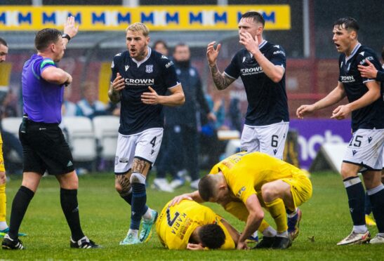 Dundee's Josh Mulligan (right) was sent off after a challenge on Jaze Kabia
(Image: SNS).