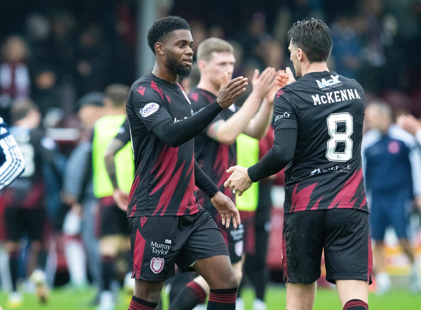 Kareem Isiaka and Michael McKenna at full-time. Image: SNS