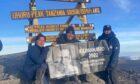 Jim Fairlie pays tribute to his brother Andrew Fairlie at the top of Mount Kilimanjaro.