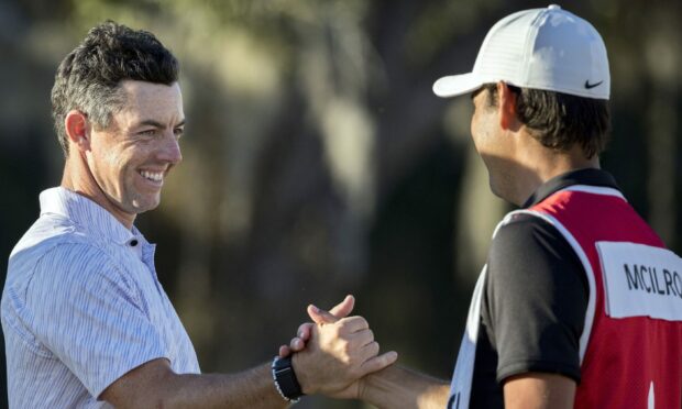 Rory McIlroy celebrates getting to world number one. Image: AP.