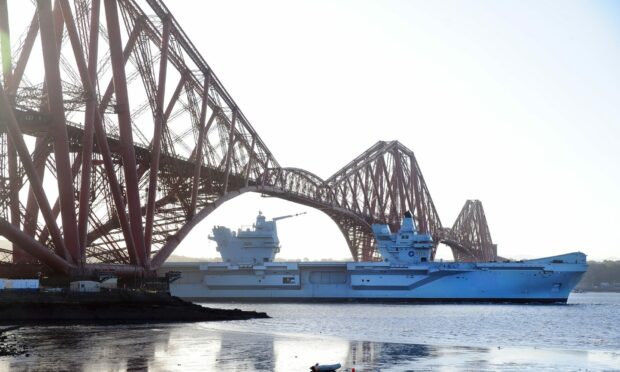 HMS Prince of Wales goes under the Forth Bridge in Fife