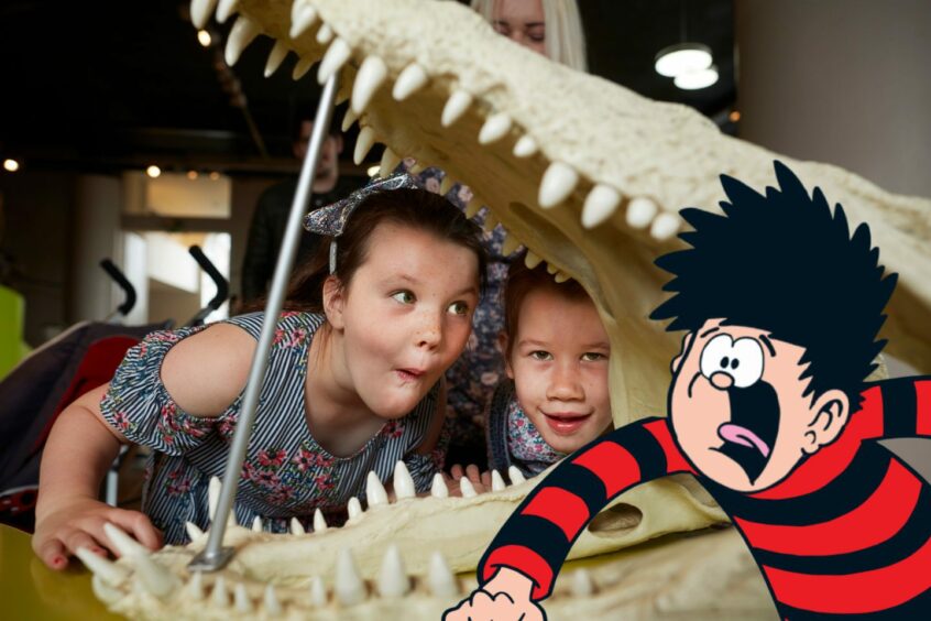 children marvel at a crocodile's skeleton in the National Museum of Scotland, one of many free things to do in Scotland