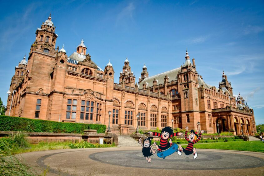 Beanotown characters jump in front of Kelvingrove Art Gallery and Museum, one of many free things to see and do in Scotland