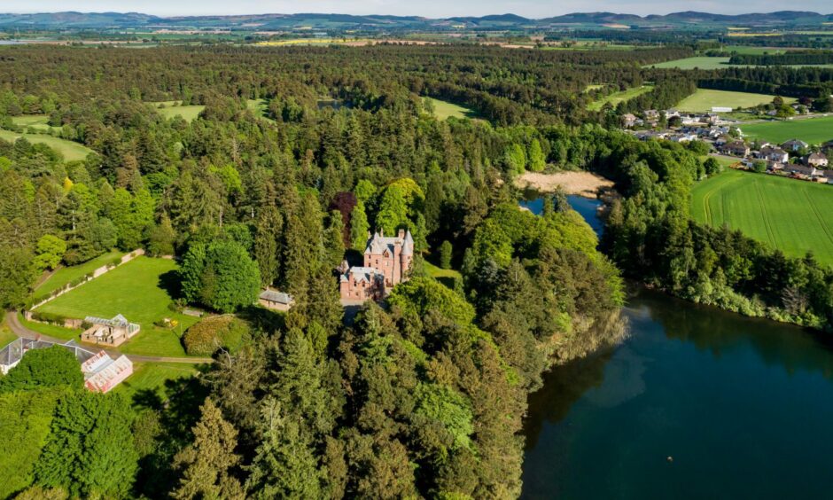 The castle on the edge of its own loch.