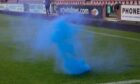 A smoke bomb thrown onto the pitch at East End Park. Image: Alex Todd | Sportpix.org.uk.