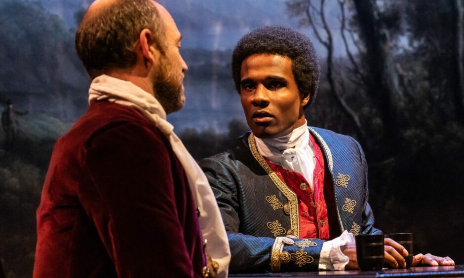 Matthew Pidgeon as Sir John Wedderburn and Omar Austin as Joseph Knight on stage in the National Theatre of Scotland's production of Enough Of Him.