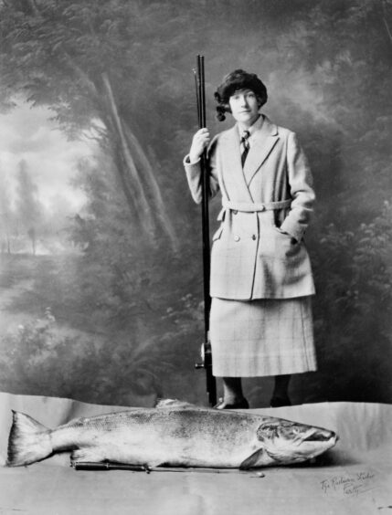 Georgina Ballantine standing next to enormous salmon
