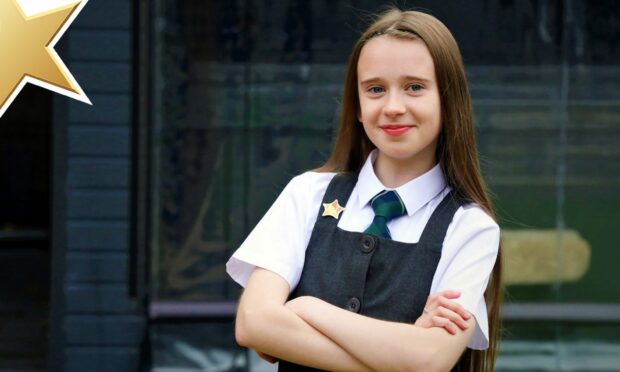 Catherine Letford (10) with her Gold Star. Image: Gareth Jennings/DC Thomson.