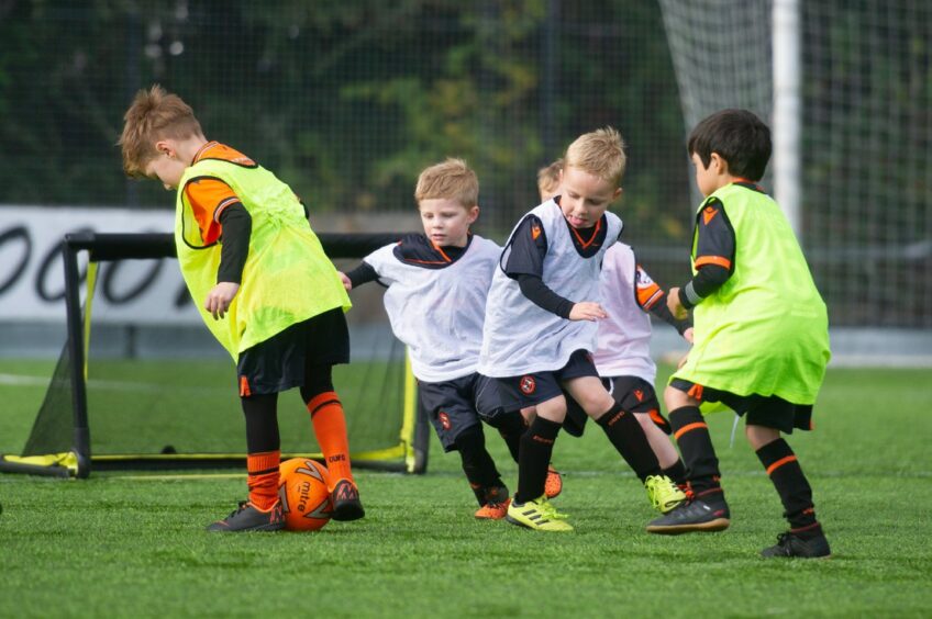photo shows small boys in Dundee United kits playing football.