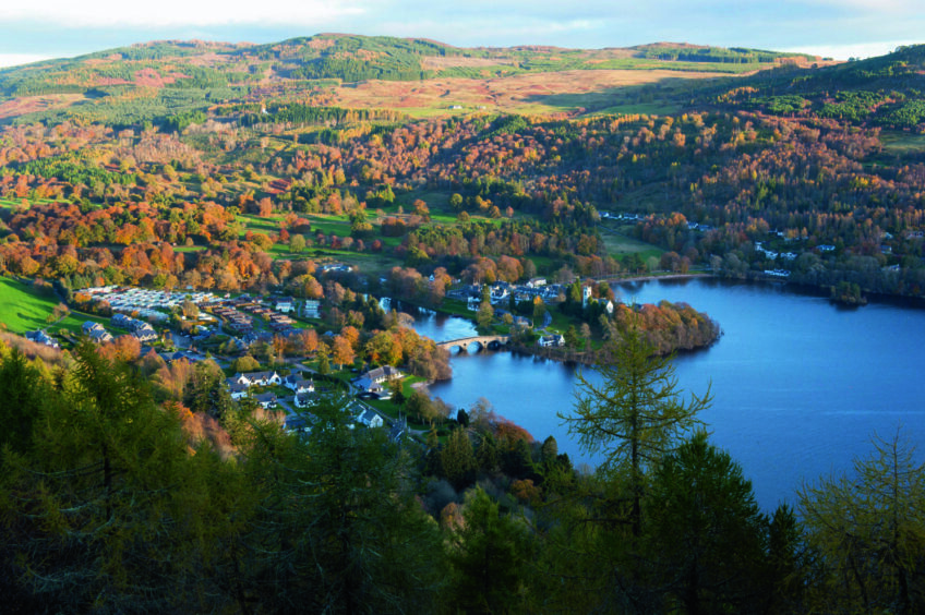 aerial shot of Kenmore, surrounded by hills and forests on the shores of loch Tay.