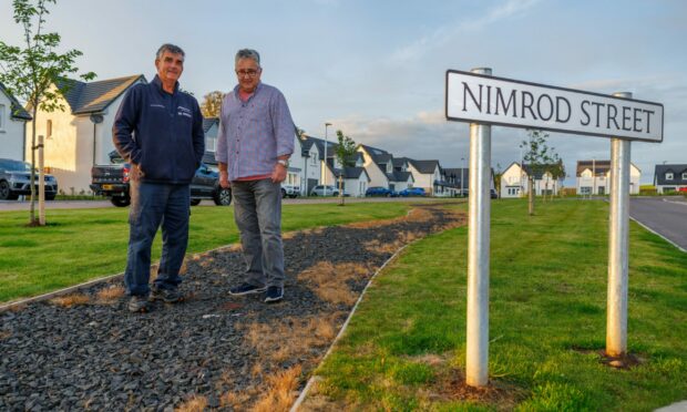 Alan Aitken and Harry Gould, residents at Balgillo Heights in Broughty Ferry,  are angered about the state of a 'dangerous' path that has been left unfinished for 18 months. Image: Kenny Smith/ DC Thomson