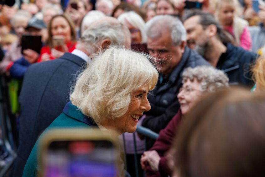 Queen Consort Camilla speaks to people gathered in Dunfermline.