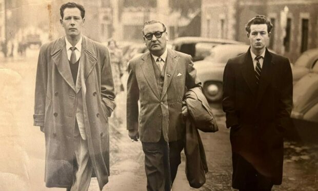 Dundee sporting promoter George Grant, centre, with sons George, left, and Jack, on the way to the high court to hear the case against an extortionist who threatened violence against Jack.