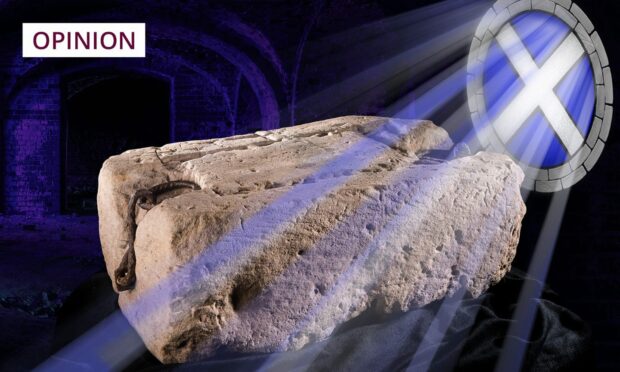 image shows the Stone of Destiny bathed in the blue and white light of a saltire-shaped stained glass window.
