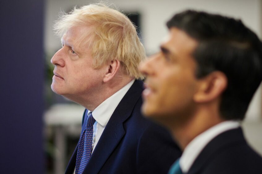 Photo shows Rishi Sunak and Boris Johnson.