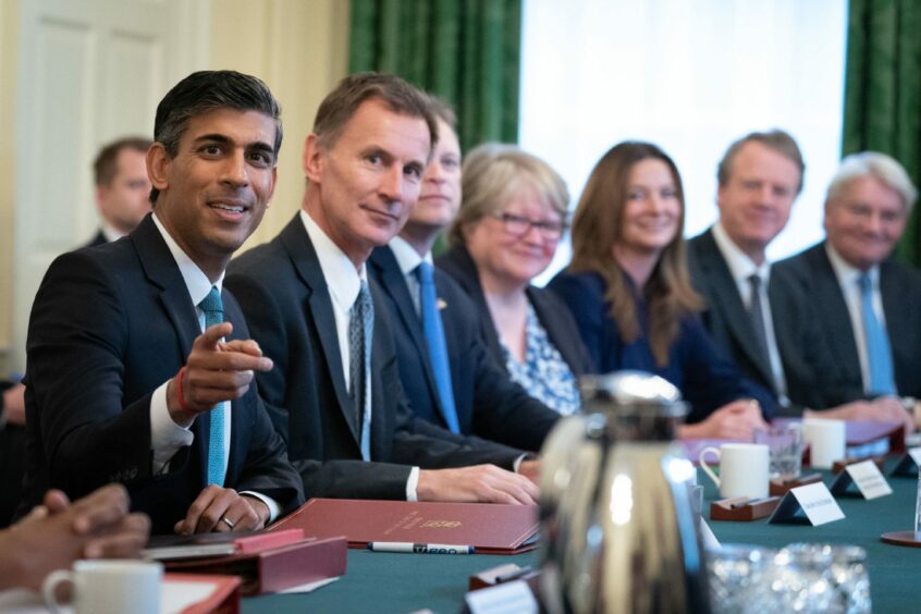 photo shows Rishi Sunak with members of his cabinet round a meeting table in Downing Street.
