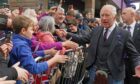 King Charles wore a kilt as he met crowds in Dunfermline.