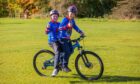 Brothers Lewis Monaghan (aged 12, front) and Logan Monaghan (aged 11, back) from Comrie, are spotted having a fun time at the festival.