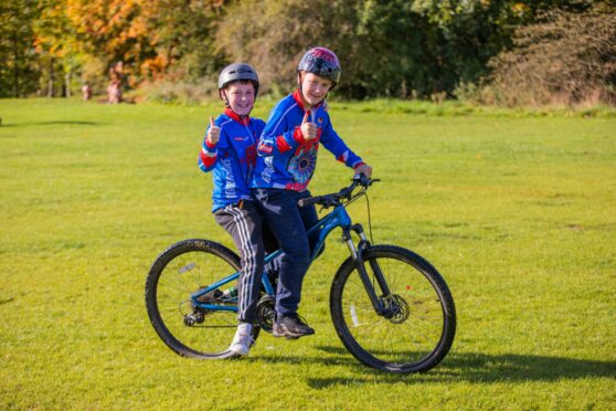 Brothers Lewis Monaghan (aged 12, front) and Logan Monaghan (aged 11, back) from Comrie, are spotted having a fun time at the festival.