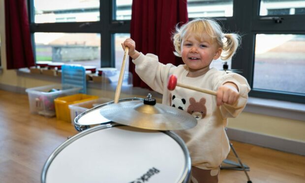 Niamh O'Hara (2) from Kirkcaldy enjoys drumming at the session.