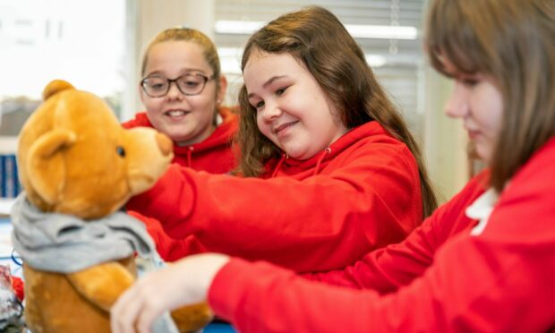 Primary 7 pupils at Leslie Primary School did an exercise of dressing up a teddy bear to show the steps involved in getting dressed and how this affects people with Dementia. Image: Steve Brown / DC Thomson.