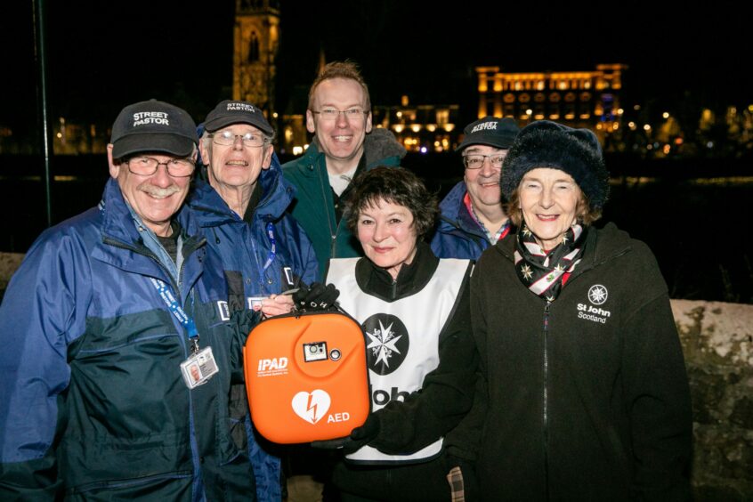 Sandy, second left, and other street pastors with a new defibrillator earlier this year.