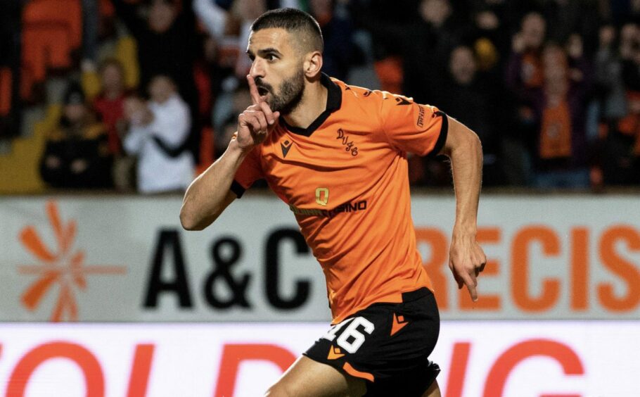 Aziz Behich celebrates after scoring one of his four goals for Dundee United