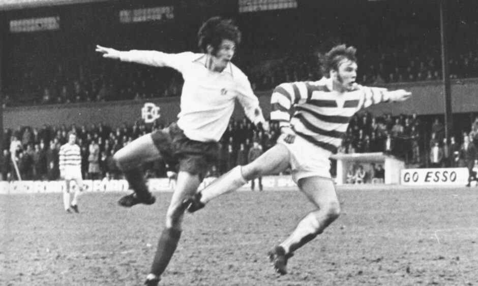 Dundee's John Duncan (left) goes for goal against Greenock Morton at Dens Park.