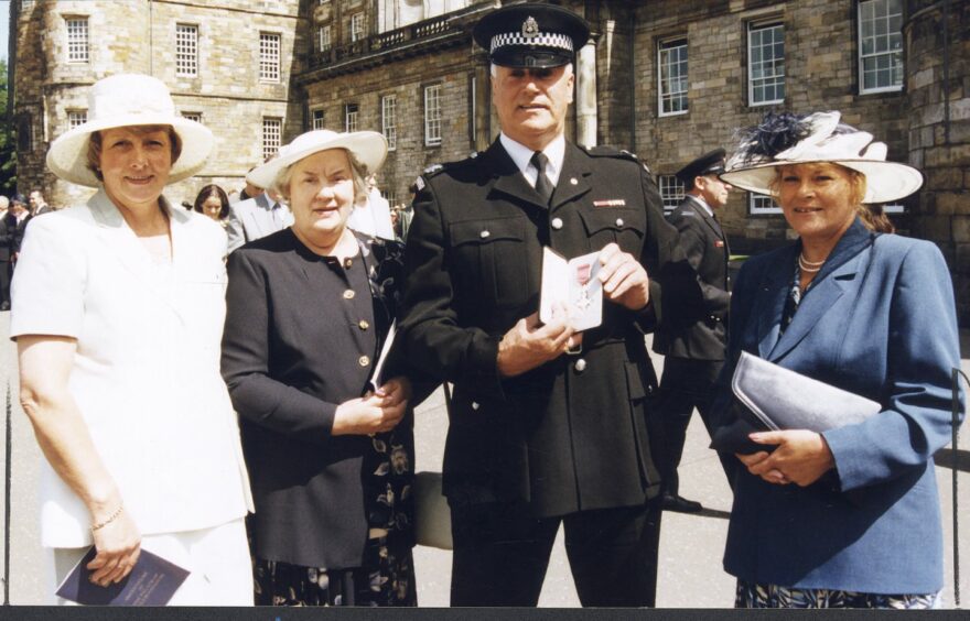 Doug Davidson centre, after receiving his MBE at Holyrood. His sister Elinor Phillips and aunt Julia Collier are on the left, and sister Jennifer Duguid to the right.