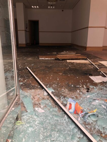 The smashed entrance of the former Cheltenham and Gloucester Building Society branch. Image: James Simpson/DC Thomson.
