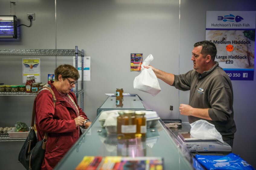 Paul Hutchison serving a customer at his shop at his shop in Glenrothes in 2022. 