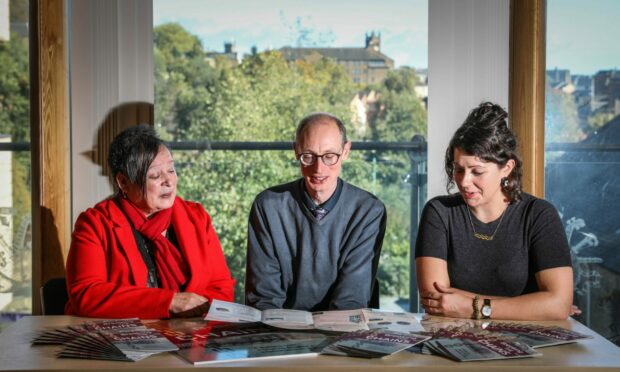 Georgia Cruickshank, chairperson of the Black History Working Group; Matthew Jaron from Dundee University and library and information officer Erin Farley with the map. Image: Mhairi Edwards/DC Thomson.