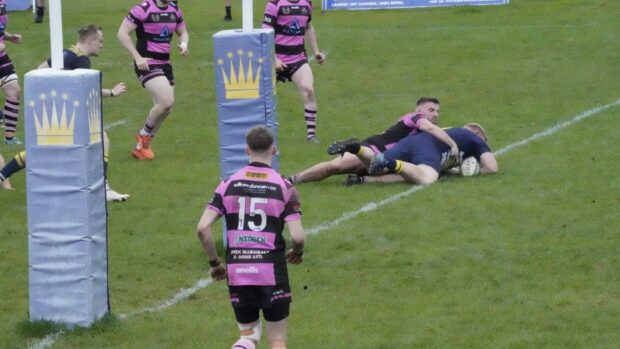 Tom Hall scores the first of his two tries for Dundee Rugby.