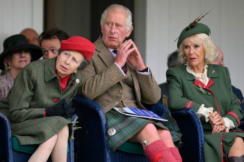 Princess Anne with King Charles and Camilla watching the action at the Braemar Games