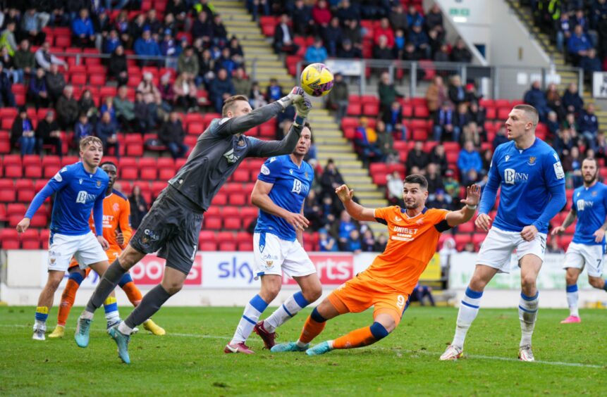 Elliott Parish punches the ball clear of the St Johnstone box.